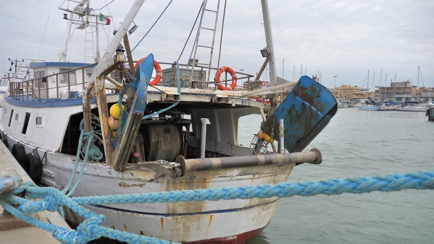 Fishing boats moored at the dock waiting to return to the crab fishing grounds