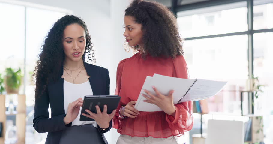Tablet, advice and business woman with manager for teamwork, feedback and planning in office collaboration. Biracial people walk with report review, data analysis and discussion on digital technology | Shutterstock HD Video #1101918125