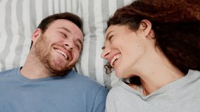 Love, happy couple and selfie on bed in bedroom home, bonding or affection. Video recording, self portrait and top view of man and woman creating romantic memory for internet or post on social media - Powered by Shutterstock - Get 15% off with code: PIKWIZARD15