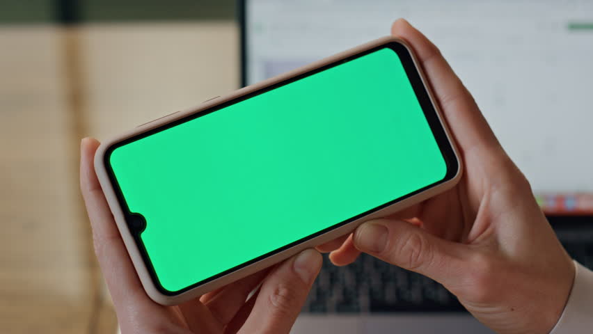 Businesswoman arms holding mockup display indoors. Closeup unknown formal boss using chroma screen smartphone alone. Anonymous ceo watching horizontal green mobile phone online. Communication concept  Royalty-Free Stock Footage #1101919983