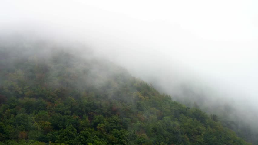 evaporation after rain in the mountains. thick fog in the mountains after rain poor visibility. High quality 4k footage
