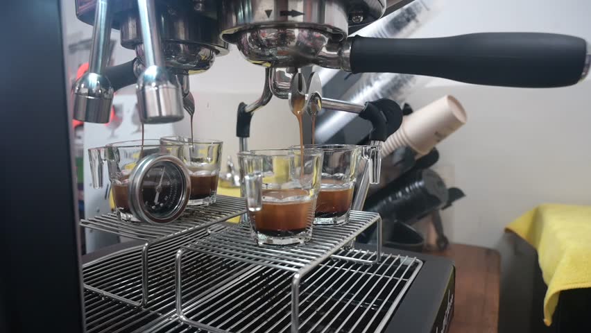 Professional espresso machine pouring strong looking fresh coffee  | Shutterstock HD Video #1101923469