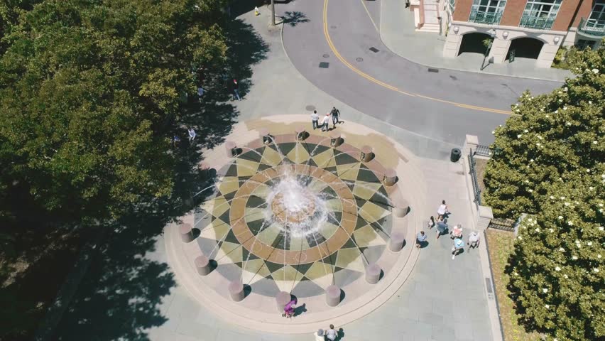 Joe Riley Waterfront Park Fountain Charleston South Carolina - Drone moving up to expose City on a sunny day