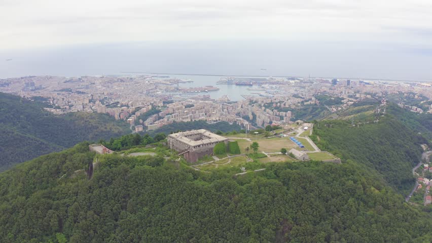 Inscription on video. Genoa, Italy. Forte Begato - Fortified with angular bastions around a central courtyard and supported by a broad embankment. Text from small balls, Aerial View, Point of interes