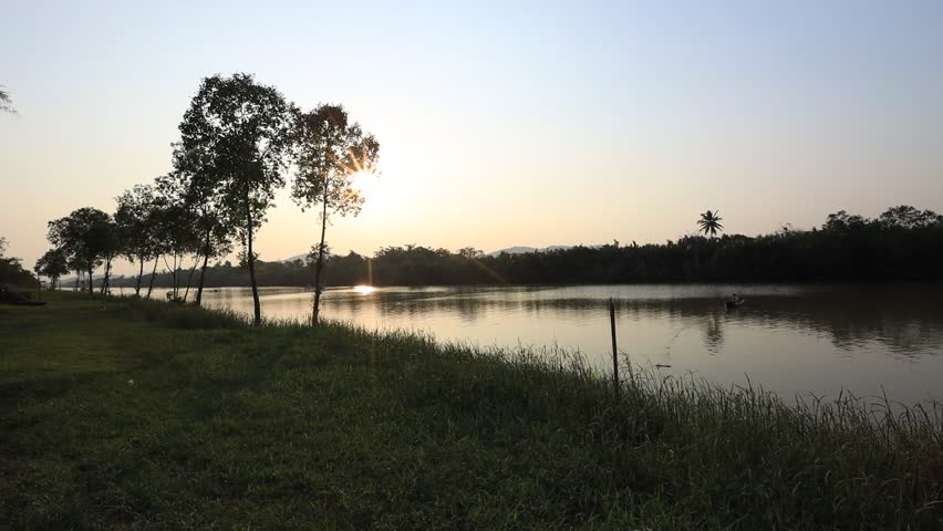 Video background Nature evening of changing colors of the sun in the mountains, surrounded by rivers and mangroves, the integrity of the ecosystem.