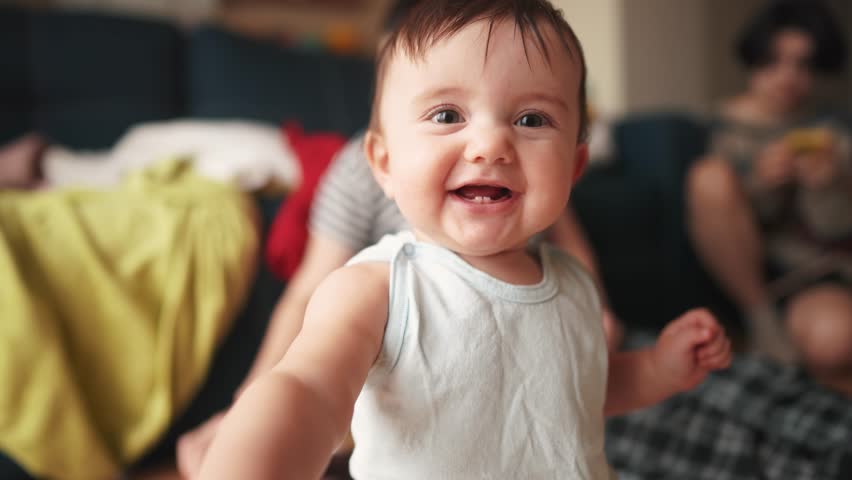 Baby smiles at camera and plays. happy family kid dream concept. baby trying to hug the camera smiling playing close-up. baby stretches his hand smiling looks at the camera big eyes lifestyle | Shutterstock HD Video #1101935423
