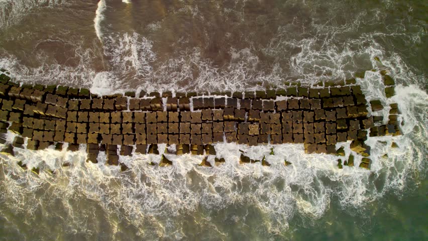 Aerial top down of cement breakwater, Madiera, Portugal