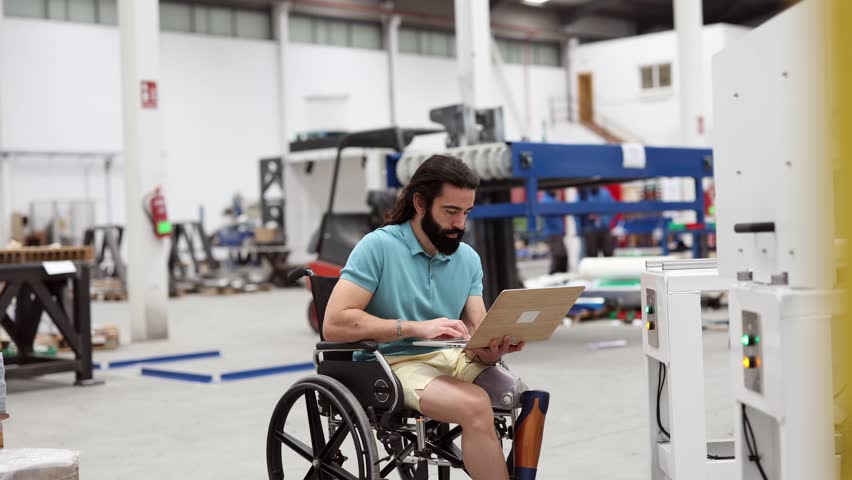 through the use of adaptive equipment and workplace accommodations, a person with a disability can contribute their unique skills and expertise as an engineer in a cutting-edge robotics factory Royalty-Free Stock Footage #1101937607