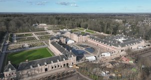 Take in the stunning beauty of Paleis Het Loo from a unique perspective with this top-down drone video that showcases the palace's impressive architecture.