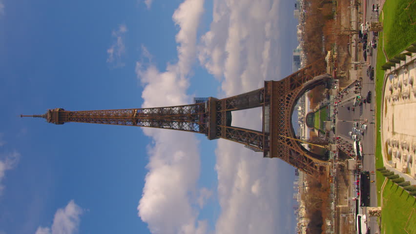 Vertical video famous square Trocadero with Eiffel tower in the background time lapse. Trocadero and Eiffel tower are the most visited attractions of Paris. Blue cloudy Royalty-Free Stock Footage #1101938117