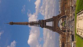 Vertical video famous square Trocadero with Eiffel tower in the background time lapse. Trocadero and Eiffel tower are the most visited attractions of Paris. Blue cloudy