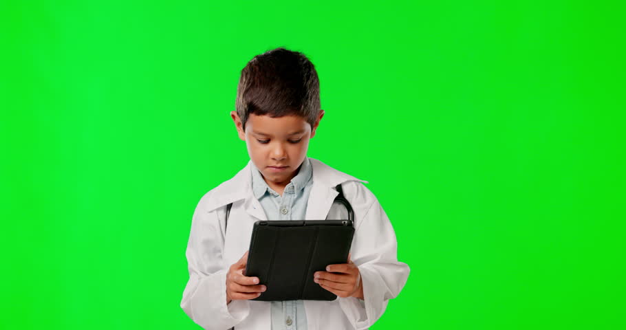 Face, doctor and kid with tablet on green screen isolated on background in studio on a mockup. Confused, portrait and thinking boy with touchscreen technology for healthcare, medical and pretend.