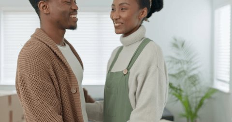 Love, new home and happy black couple in apartment, excited about future together. Real estate, home improvement and young black man and woman embrace, hug and standing in living room after moving in Stock-video