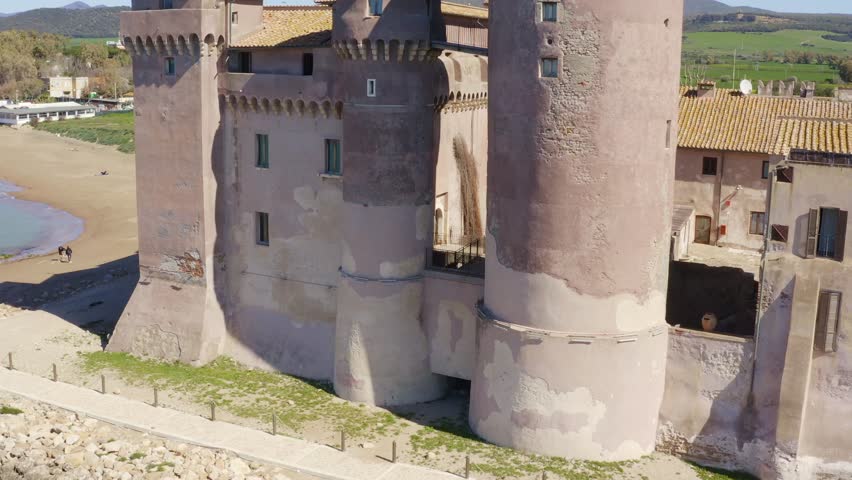 Aerial view of the Castle of Santa Severa, located in Santa Marinella in Lazio, in the Metropolitan City of Rome, Italy. It is a medieval castle built on the beach and overlooking the Tyrrhenian Sea.