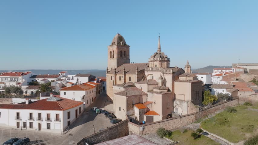 An establishing aerial shot of a Spanish fortress town Iglesia de Santa María de la Encarnación. Jerez de Los Caballeros, Badajoz, Extremadura, Spain