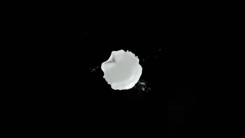 Super Slow Motion Shot of Milk Splash Flying Towards Camera Isolated on Black at 1000fps. Royalty-Free Stock Footage #1101942793