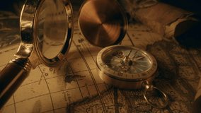 Compass and magnifier on a old vintage world map with countries and continents. Retro style. Concept of geography or global history and cartography. Wars of conquest and navigation. 4K ProRes - Powered by Shutterstock - Get 15% off with code: PIKWIZARD15