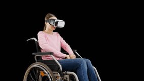 Woman wheelchair user practicing martial arts in VR headset, video game