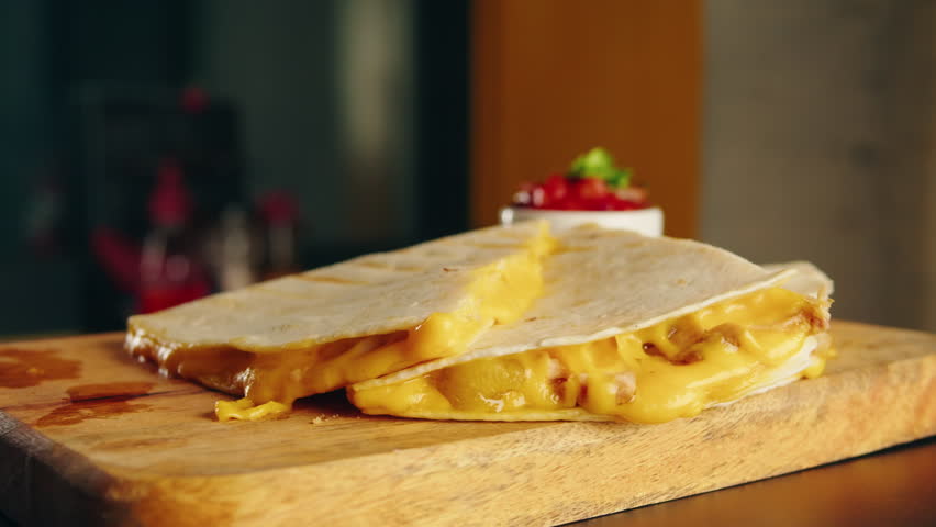 Close up of cheese quesadilla, Eating Traditional Mexican food, tex mex cuisine. Hands taking cooked quesadilla with vegan pork beef meat and vegetables,  Royalty-Free Stock Footage #1101958113
