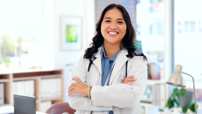 Happy asian woman, doctor and confidence with arms crossed for healthcare insurance at hospital. Portrait of confident female medical professional face standing and smiling in health advice at clinic | Shutterstock HD Video #1101962751
