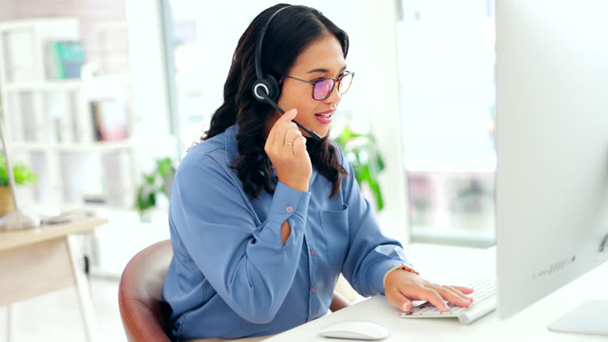 Customer support, computer and typing woman, agent or consultant call center, online solution or help desk. International virtual assistant or friendly asian person consulting and talking on desktop | Shutterstock HD Video #1101962763