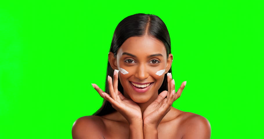 Happy woman, face and cream on green screen, smile and color background in studio. Portrait, beauty lotion and female model laughing in healthy glow, skincare results or facial makeup of uv sunscreen | Shutterstock HD Video #1101963059
