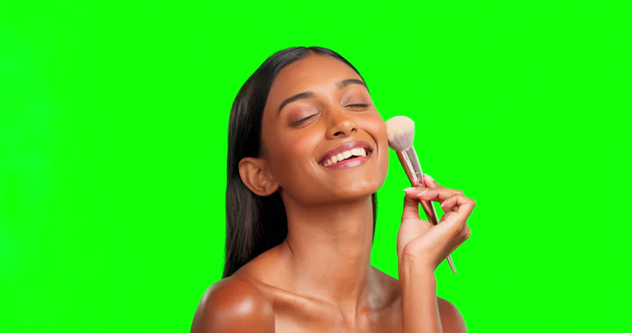 Woman, makeup and face brush on green screen, studio and skincare foundation, blush or contour. Happy female model, portrait and brushing facial powder, beauty cosmetics and smile on color background | Shutterstock HD Video #1101963079