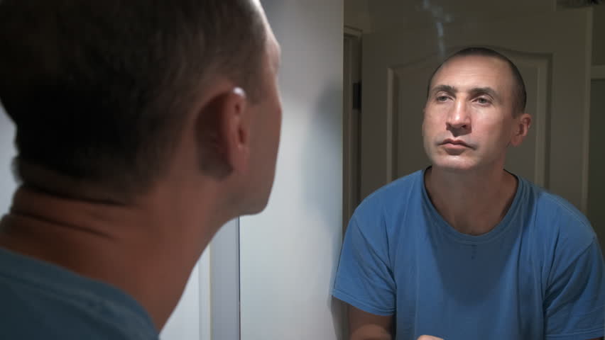 Facial care after shaving. A man moisturizes his face after shaving. | Shutterstock HD Video #1101963885