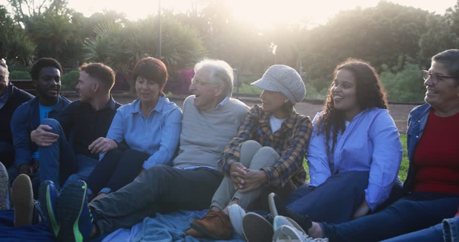 Group of multigenerational people enjoy day at city park - Multiracial friends with different ages having fun together Royalty-Free Stock Footage #1101963931