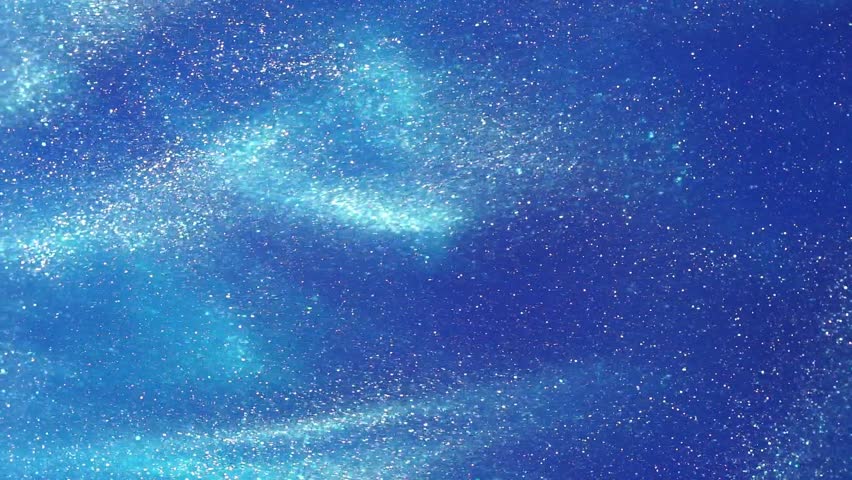 White Glowing Dust Particles Floating in a blue liquid. Gusts of currents Floating particles of white dust on a blue background. Abstract snowy or magic galaxy movement 4K background.