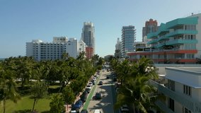 Aerial rise reveal Miami South Beach Ocean Drive facing south towards inlet and highrise condominiums