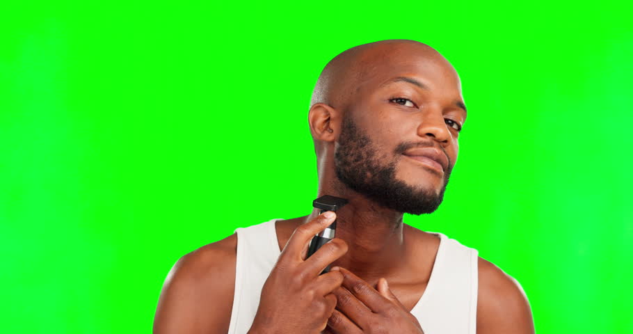 Black man, face hair removal and green screen, shaving and smile in portrait, beauty and grooming. Hygiene, smile and male, shave with disposable razor and cosmetic care, mockup on studio background | Shutterstock HD Video #1101967193