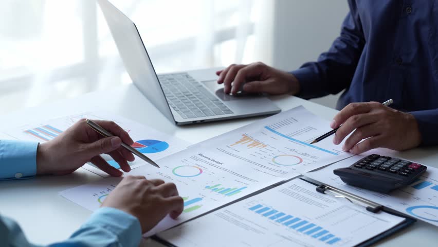 Financial analyst analysis business financial report on digital tablet during discussion at meeting of corporate showing the results of their successful teamwork., business meeting concept, Marketing	 | Shutterstock HD Video #1101967735