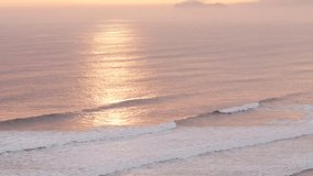 video of the waves of the sea (Pacific Ocean in Lima, Peru) at sunset. Concept of Landscapes and Nature.