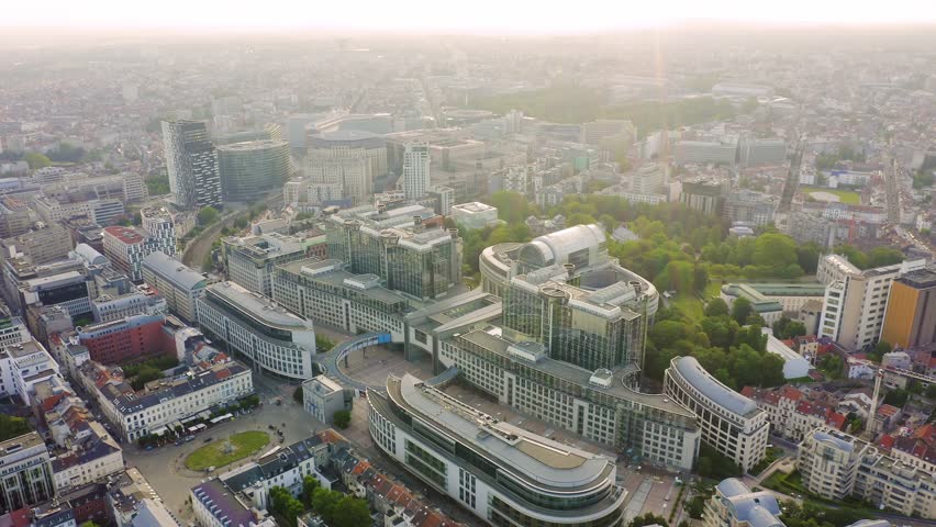Inscription on video. Brussels, Belgium. The complex of buildings of the European Parliament. State institution. Heat burns text, Aerial View, Point of interest
