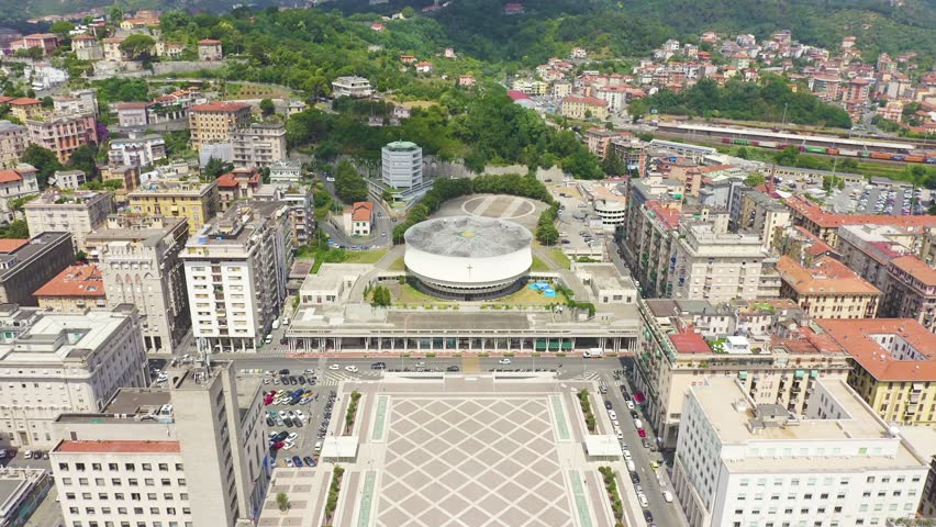 Inscription on video. La Spezia, Italy. Cathedral of Christ the King. City view. Different colors letters appears behind small squares, Aerial View