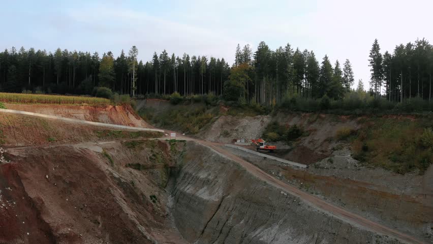 Slow flight over a quarry with bulldozers