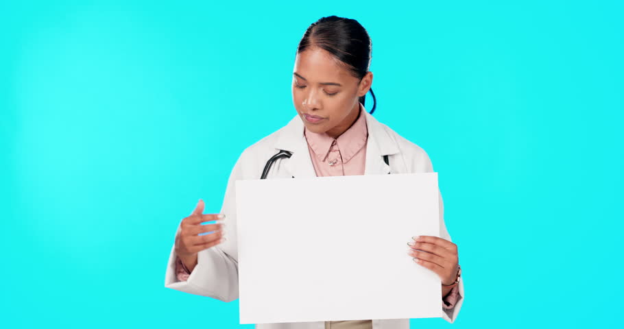 Doctor, woman and pointing at blank poster with mockup space for healthcare advice, presentation and blue background. Young, female medic and paper board for medical logo, wellness brand or portrait | Shutterstock HD Video #1101974837