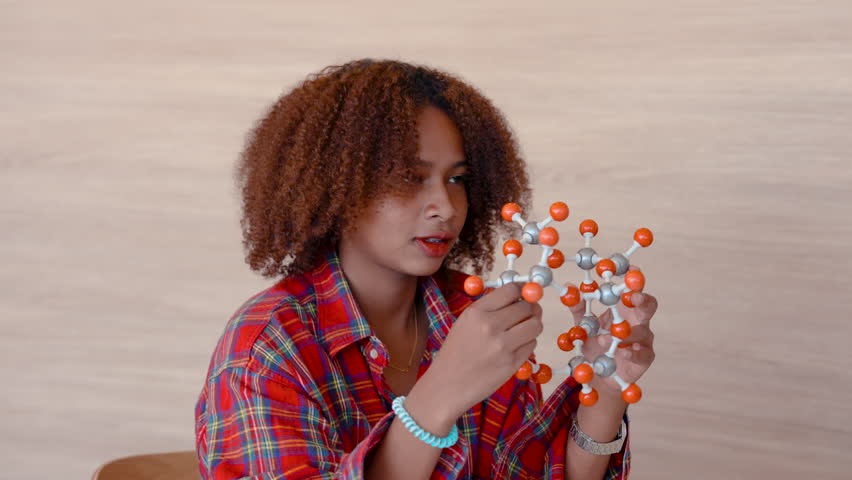4K, african girl close up Was interested in a scientific model from the advice. Woman sitting in the ocean chamber. The university's operational area. while waiting to enter the classroom | Shutterstock HD Video #1101982701