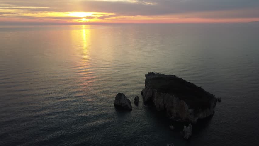 Spring in Montenegro. Drone shots. Sunset over the Adriatic Sea near the island of Old Ulcinj.