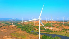 Wind turbines are an essential component of clean energy concepts as they generate electricity without producing greenhouse gas emissions or pollution. renewable energy concept. drone aerial view

