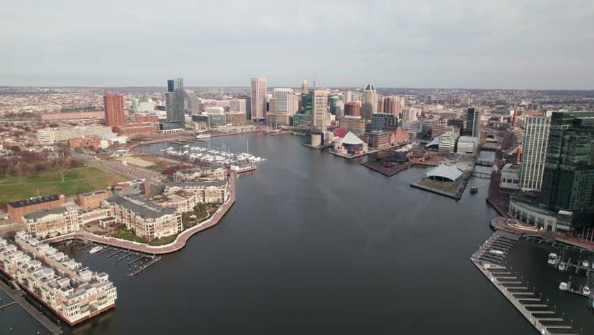 Long aerial pull-out. Baltimore, MD city skyline, 4K.