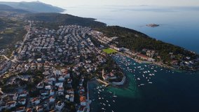 Hvar old town on island Hvar in Croatia, Dalmatia in Adriatic sea. Summer vacation destination. Aerial view. 4k drone video