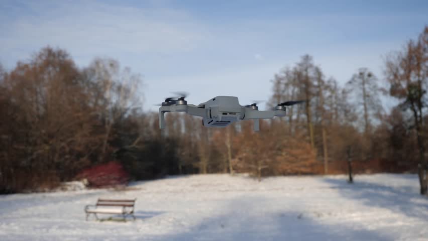 Mini drone is flying in the air