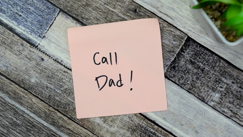 Concept of Call Dad! write on sticky notes isolated on Wooden Table. 
 | Shutterstock HD Video #1102003677