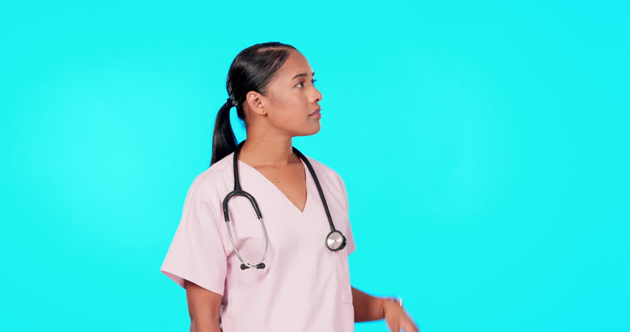 Woman, doctor and point in studio for mockup, healthcare decision or tips menu by blue background. Young female medic, pointing or portrait for disagree, mock up space or advice for bad health habits | Shutterstock HD Video #1102010317