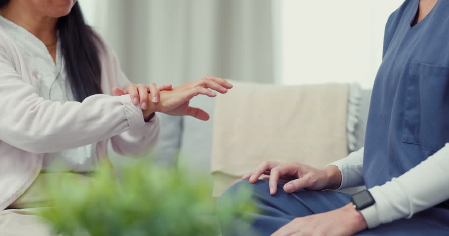 Help, hand injury or woman explaining to nurse for muscle or bone rehabilitation, consulting or advice. Support, accident or senior Asian patient talking or speaking to a doctor for physiotherapy | Shutterstock HD Video #1102018745