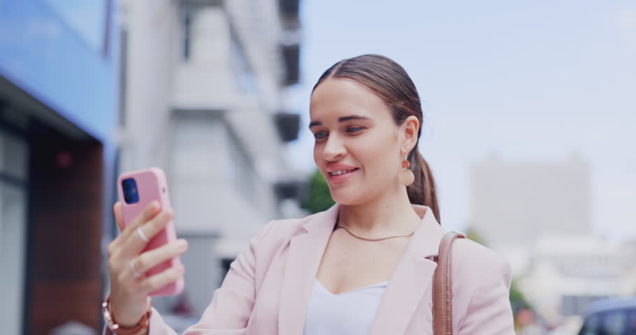 Video call, wave and woman with phone in city, talking or speaking to contact in urban street. Cellphone, happiness and business person in webinar, waving in online chat or live streaming outdoor. | Shutterstock HD Video #1102018921