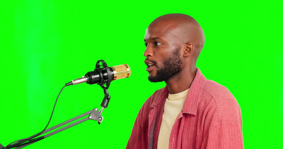 Podcast, green screen and man talking about political and human rights into microphone. Live streaming, media presenter and web conversation of a young male speaking for voice broadcast and advice | Shutterstock HD Video #1102018937