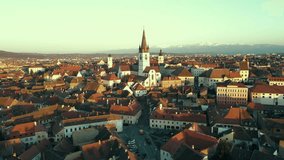Footage of the Evangelical Cathedral in Sibiu, Romania. The video was shoot from a drone at sunset while flying forward towards the Cathedral with the camera level for a panoramic view.